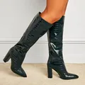 Detail of dark green crocodile embossed knee-high boots with pointed toe and block heel - Black