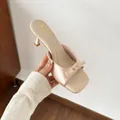 Elegant beige satin mule sandals with decorative bow detail and kitten heel for women. - 33 / 6cm Heel / Apricot