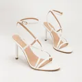 Elegant white stiletto sandals with cross straps and open toe for chic women. - White PU