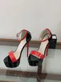 Close-up of 16cm red and black patent leather platform stiletto sandals with ankle straps. - 34 / Black Red