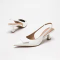 Elegant white patent leather pointed toe slingback heels with square buckle ornament. - 35 / White