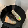 Detail view of holographic wedge sandals with transparent straps and platform sole. - 34 / Gold