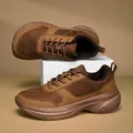 Close-up detail of brown wide-toe winter sneakers featuring warm fleece lining and thick soles - 36 / Yellow