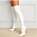 White crackle texture thigh-high boots with stiletto heel and pointed toe, chic style. - White