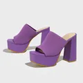 Detail of purple knit platform mules with chunky high heels and square toe. - Purple
