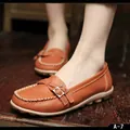 Comfortable women's orange genuine leather loafers with decorative metal buckle and soft sole - Orange