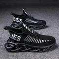Detail of black flyknit running shoes with unique wavy blade-style hollowed out sole - 36 / Black