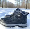 Close-up of black fur-lined winter snow boots for men and women on outdoor snow. - 36 / Black