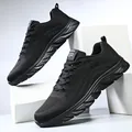 Detail view of lightweight black fly-knit running shoes with breathable mesh upper - 38 / All Black