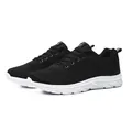 Breathable black mesh running shoes for men featuring a lightweight white flexible sole - 39 / Black and White