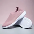 Breathable pink fly-knit slip-on walking shoes for women featuring a lightweight white sole - 35 / Pink