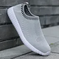 Grey knitted mesh slip-on sneakers for women with flat round toe for casual walking - Light Gray