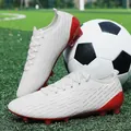 Professional white and red low-top soccer cleats for artificial turf training sessions - White