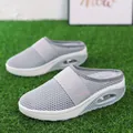 Close-up of grey breathable mesh slip-on mules with comfortable air cushion sole. - Light Gray
