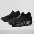 Black air cushion sneakers for women featuring breathable mesh fabric and lightweight sole - 35 / Black