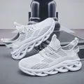 White and grey breathable men's running shoes featuring shock-absorbing wave soles - 39 / White