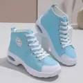 Stylish close-up of light blue canvas high-top sneakers with white air cushion soles. - 35 / Sky Blue