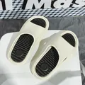 Cream and black sporty slides for couples featuring a non-slip textured footbed design - 36 / Beige