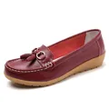 Classic dark red leather loafers for women featuring decorative tassels and soft comfortable wedge sole - Burgundy