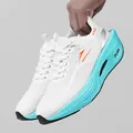 Lightweight white mesh carbon plate running shoes with cyan cushioned soles and orange accents - 38 / White Green