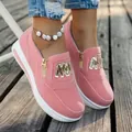 Close-up view of pink women's platform casual sneakers with gold side zipper detail - 35 / Pink