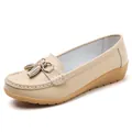 Elegant beige leather loafer for women featuring decorative tassel and a soft wedge sole - Beige