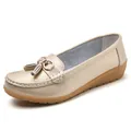Elegant metallic gold leather loafers for women with stylish tassel and buckle detail - Gold