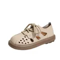 Detailed side view of a beige hollowed-out casual shoe with brown rubber sole - Apricot
