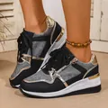Detail view of black and gold platform sneakers with lace-up design and wedge sole. - 38 / Textured Black