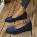 Close-up of elegant navy blue women's wedge shoes featuring embossed crocodile leather texture - 36 / Blue