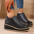 Side profile of women's black platform wedge ankle boots with zipper detail - 36 / Black