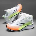 Zapatillas blancas ligeras de running con placa de carbono y detalles en naranja neón - 34 / Blanco Estándar