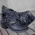 Detailed macro view of vintage distressed leather boots with punk rivets and buckles - 36 / Blue
