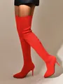 Detailed macro view of red knitted over-the-knee boots with high stiletto heels for women. - 36 / Red