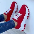 Detailed side view of red women's chunky platform sneakers with thick white soles - 35 / Red