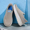 Comfortable beige slip-on mesh walking shoes with blue accents for casual wear - Tan