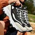 Retro chunky platform sneakers in black and white with gold accents for men and women - 35 / Black White Gold