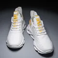 Lightweight white blade sole running shoes with breathable mesh and yellow smile accents. - 36 / White