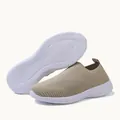 Detail of women's beige flyknit slip-on sneakers with white textured non-slip outsole. - 35 / Khaki