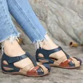 Macro view of multi-colored retro wedge sandals with cross straps and round toe - 35 / Dark Blue