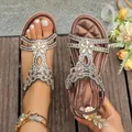 Brown bohemian flat sandals with rhinestone floral decorations and elastic strap - Bronze