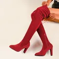 Detailed view of red suede over-the-knee boots featuring high heels and pointed toe design - 36 / Red