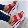 Detailed view of red platform wedge sandals with double straps and gold buckle ankle strap - 38 / Red