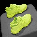 Detailed view of neon green fly-knit sock sneakers with breathable mesh and wavy soles - 28 / Green