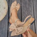 Elegant beige flat sandals with a large bow decoration and pointed toe slingback design. - 36 / Khaki