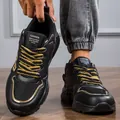 Vista dettagliata di sneaker chunky nere e oro alla moda con pelle resistente - 39 / nero e oro