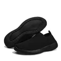 Black fly-knit slip-on walking shoes for women with flexible soft sole and mesh upper - Black