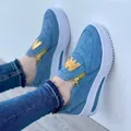 Detail of light blue suede sneakers with golden side zipper and 'W' letter patch detail - 35 / Blue