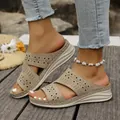 Detailed view of women's beige laser-cut wedge sandals worn with denim and white anklet. - 36 / Khaki