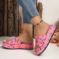 Close-up detail of stylish pink platform slippers featuring vibrant butterfly patterns - 38 / Pink Butterfly Print / Pink